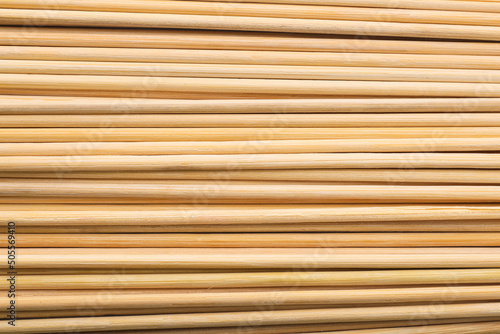Fototapeta Naklejka Na Ścianę i Meble -  Texture of wooden skewers as background, closeup