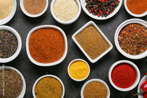 Set of different aromatic spices on dark background