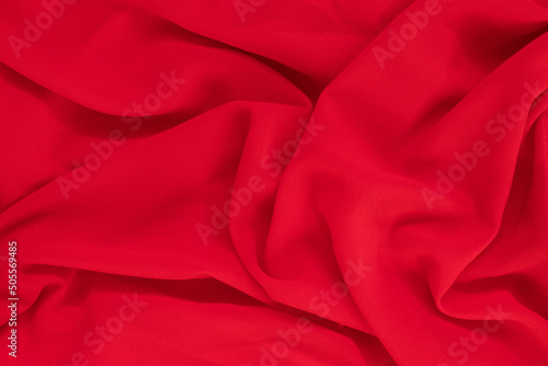 Red silk or satin fabric texture can use as abstract background.Top view.