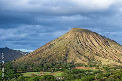 Koko Head  an extinct volcano crater  as seen from a distance  with its hiking path straight up the mountain