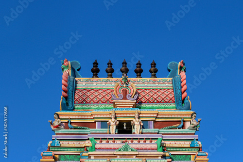 Closeup shot of details of the Kodaikanal temple on theblue sky background photo