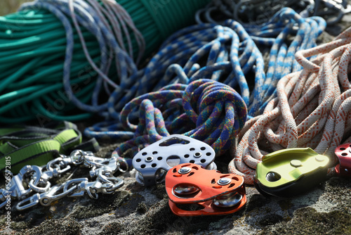 Fotografija Different belay devices and ropes on rock, closeup