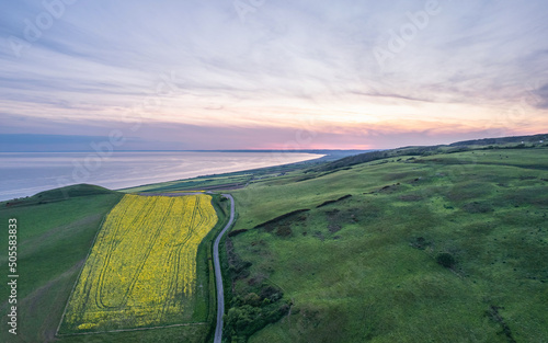 Sunset over Rapeseed field and Farmlands from a drone, Dorset, England photo