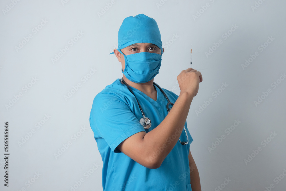male nurse holding syringe in the hand male nurse holding syringe in the hand