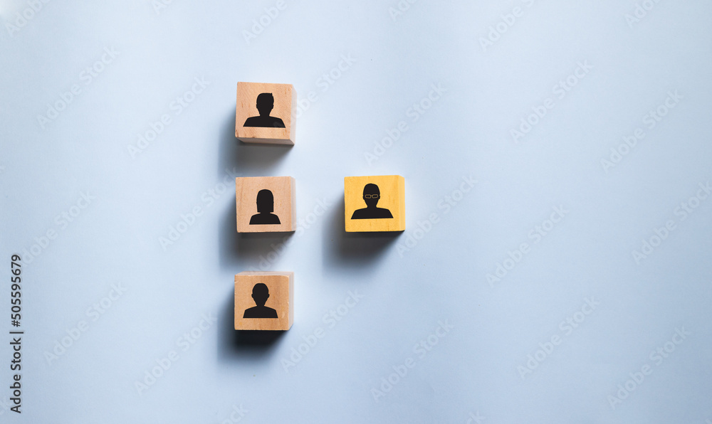 Top view wooden blocks with people icon on blue background. Concept for company and human resorce manangement. Top view wooden blocks with people icon on blue background. Concept for company and human resorce manangement.
