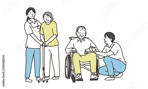 車椅子と杖をつく高齢者と介護士	 photo