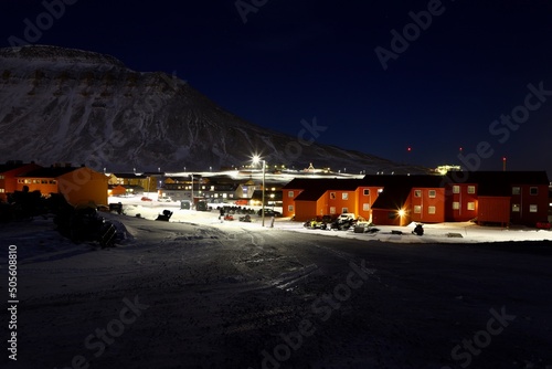 town longyearbean svalbard / spitzbergen at night with snow and ice  photo