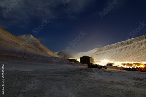 town longyearbean svalbard / spitzbergen at night with snow and ice  photo