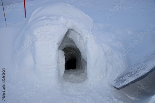 entrance ice cave in svalbard / spitzbergen with snow and ice