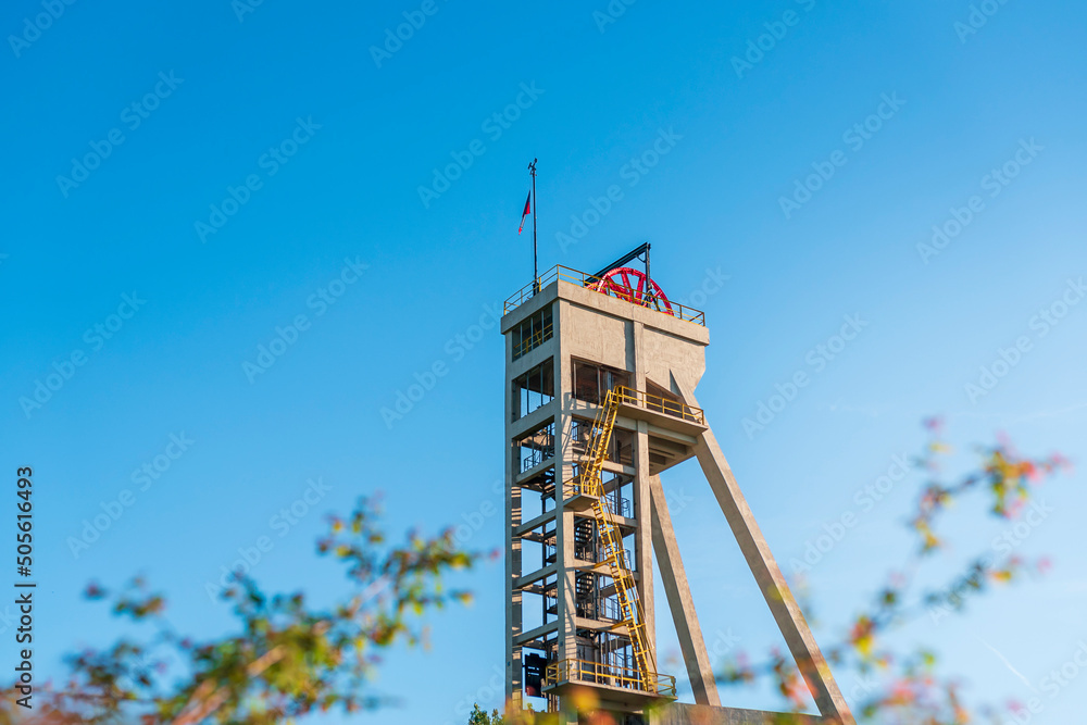 Mine shaft tower "Prezydent" in former coal mine "Königsgrube” ("Król") in Chorzów, Silesia, Poland. Tall, concrete, industrial construction build in 1933. - obrazy, fototapety, plakaty 