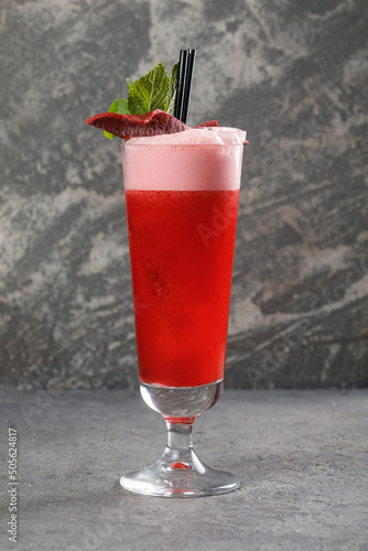 Alcohol cocktail over grey concrete background