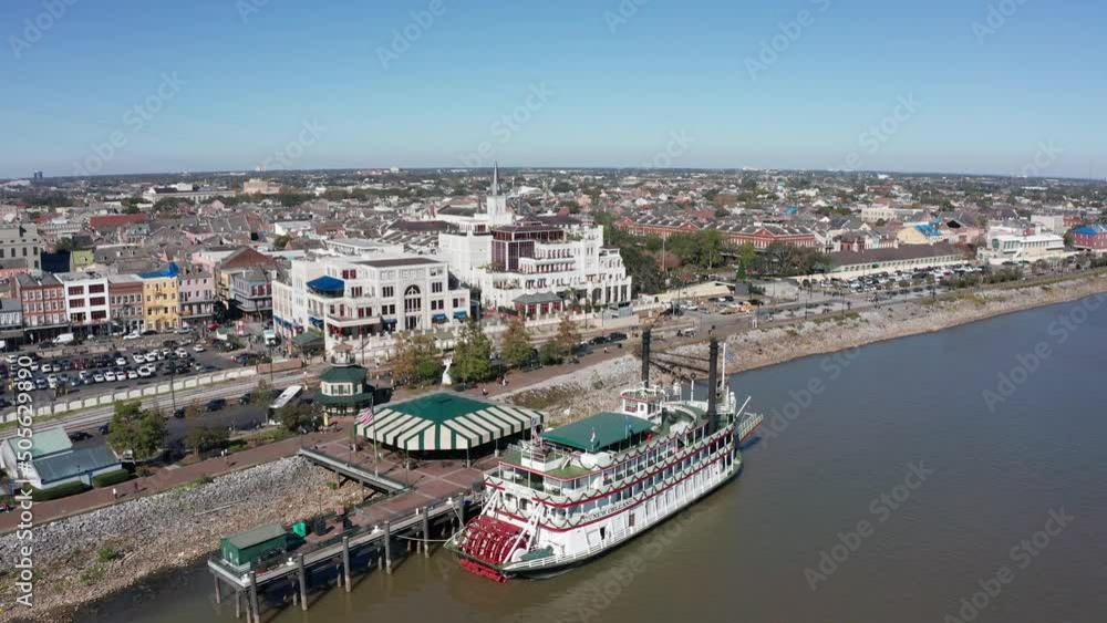 Aerial descending close-up shot of a steamboat along the Mississippi River in the French Quarter. 4K Aerial descending close-up shot of a steamboat along the Mississippi River in the French Quarter. 4K