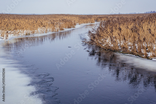 Winter view of River Narew seen from a bank in Waniewo village, Podlasie region of Poland photo