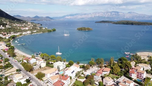 Nidri Bay, Boats and Small Madouri Island at Lefkada, Greece - Aerial Forward photo