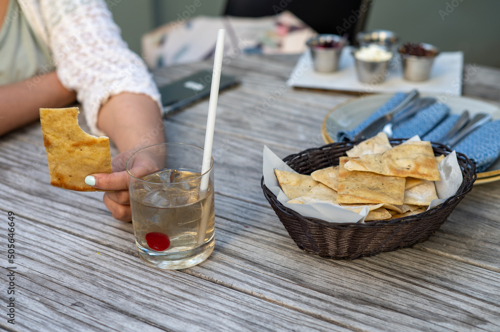 Close up shot of woman having a drinking and snacks Close up shot of woman having a drinking and snacks