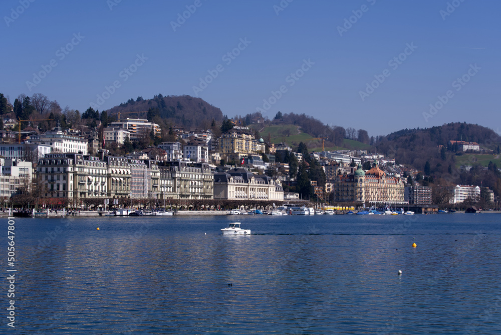 Lake Luzern with waterfront and luxury hotels on a sunny spring day. Photo taken March 23rd, 2022, Lucerne, Switzerland.