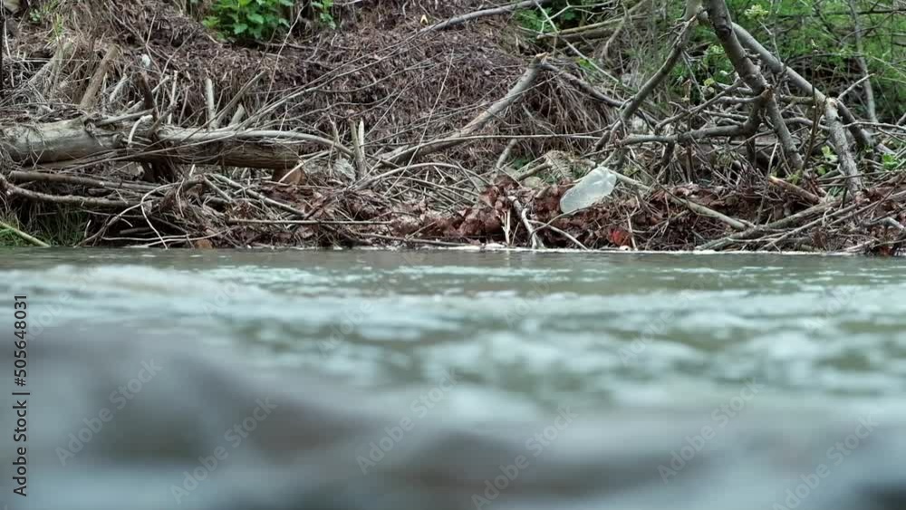 Plastic bottle in a mountain river. environment ecology concept Plastic bottle in a mountain river. environment ecology concept