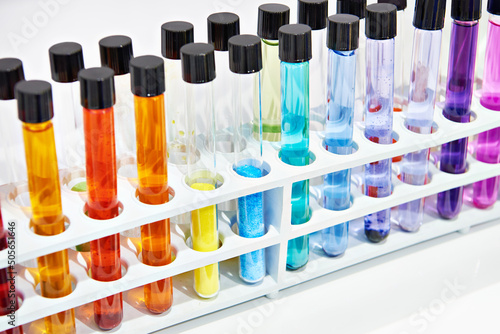 Chemical test tubes with colored liquids in laboratory
