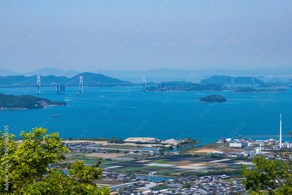 Landscape of sakaide city suburbs with the seto ohashi bridge and many islands , kagawa, shikoku, japan	