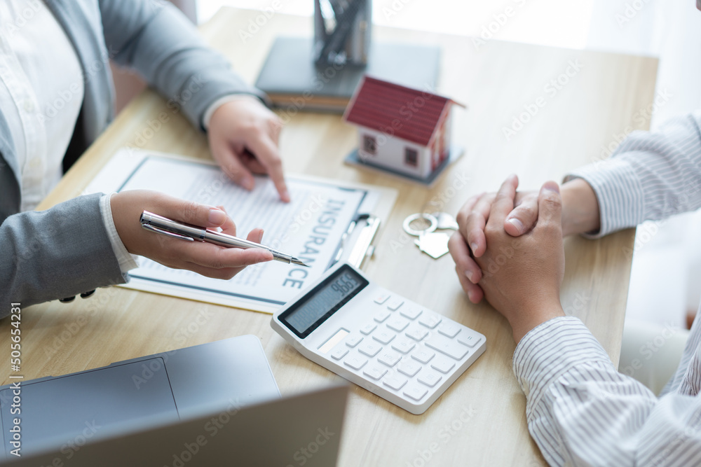 Insurance concept the broker explaining the agreement of the contract to his customer Insurance concept the broker explaining the agreement of the contract to his customer