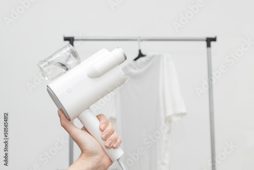 Portable steamer for clothes in hand. laundry