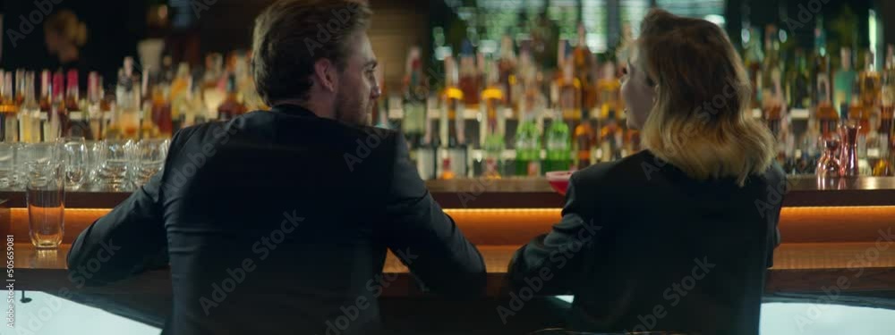 Beautiful Caucasian couple having a date in a stylish restaurant, talking and laughing. Shot with 2x anamorphic lens Beautiful Caucasian couple having a date in a stylish restaurant, talking and laughing. Shot with 2x anamorphic lens