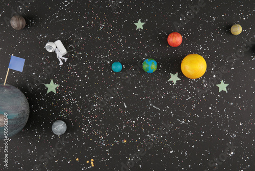 Fototapeta Naklejka Na Ścianę i Meble -  toy planets and astronaut in space