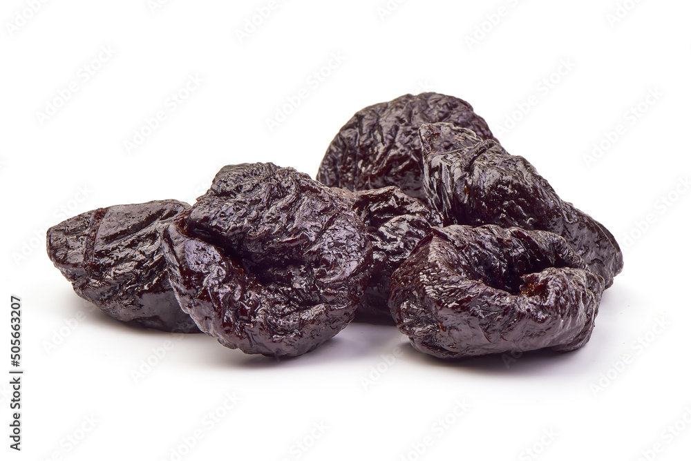 Prunes, close-up, isolated on white background. Prunes, close-up, isolated on white background.