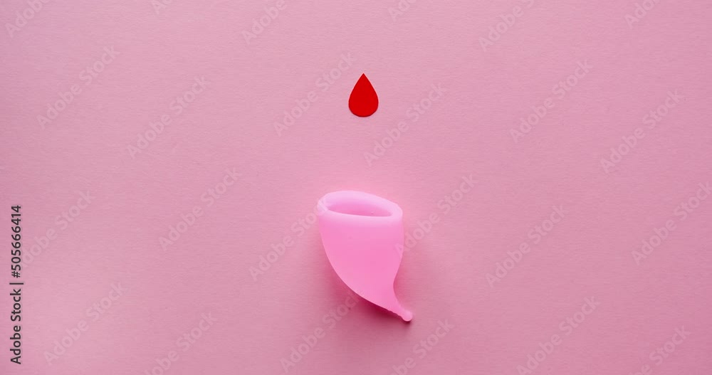 Menstrual cup and drops of blood. Looped 4K stop motion animation on a pink background Menstrual cup and drops of blood. Looped 4K stop motion animation on a pink background