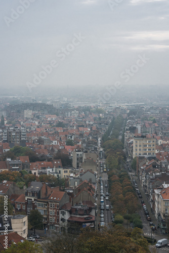 Koekelberg, Brussels Capital Region - Belgium -  Panoramic view over Brussels on a foggy  morning with the autumn colors of the Elisabeth park photo