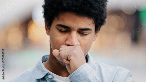 Принти на полотні Male portrait sad african american man sick guy indoors coughing covering mouth