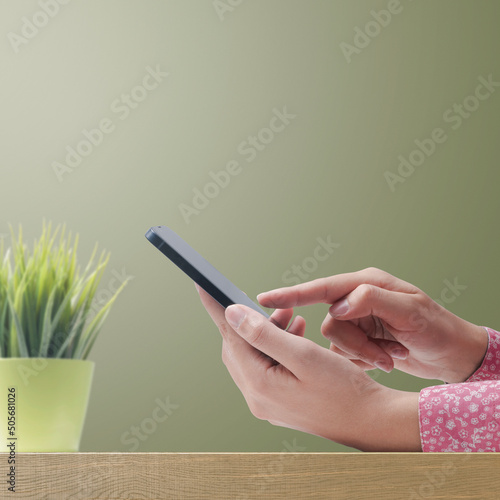 Woman connecting with her smartphone