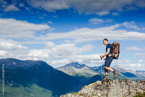Hiker on the mountain ridge. Sport and active life conceptHiker on the mountain ridge. Sport and active life concept