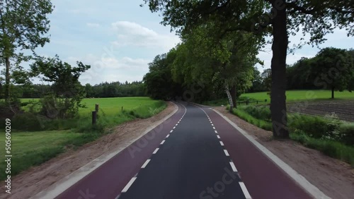 Country road at Zwiepselaan between Zwiep and Lochem in Gelderland, the Netherlands photo