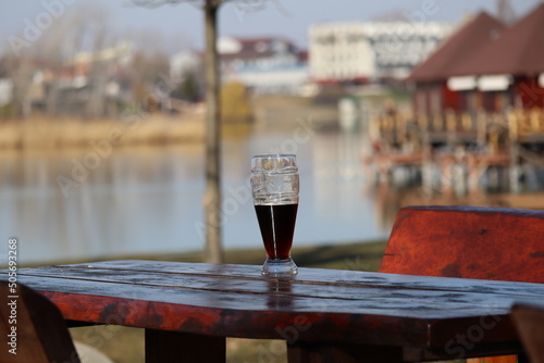 Cola on table on Gravel Lake Slnecne jazera in Senec near Bratislava, west Slovakia photo