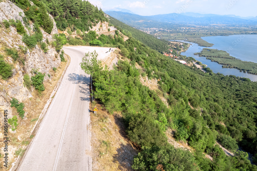 Meandering serpentine road in the mountain. Aerial view. Copter, drone view Meandering serpentine road in the mountain. Aerial view. Copter, drone view