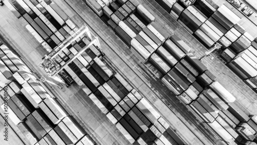 Aerial view of shipping container port terminal. Colourful pattern of containers in harbor. Maritime logistics global inport export trade transportation. photo