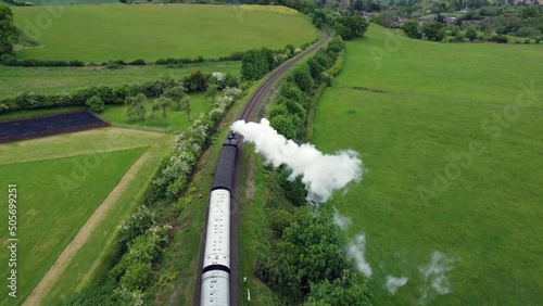 Generic aerial view of a steam train through the English countryside