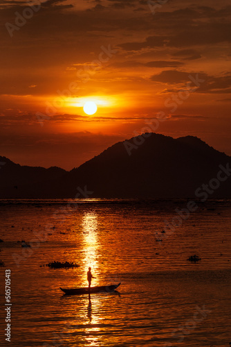 Wallpaper Mural Fishing under a full round sun during a beautiful sunset Torontodigital.ca