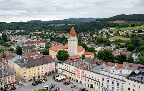 Drone view of the Altstadt Freistadt square. Old church, clock tower on the square in Austria, Tyrol photo