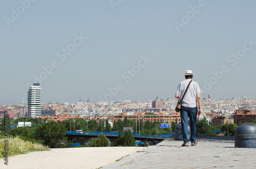 Tourist man looking at the city 