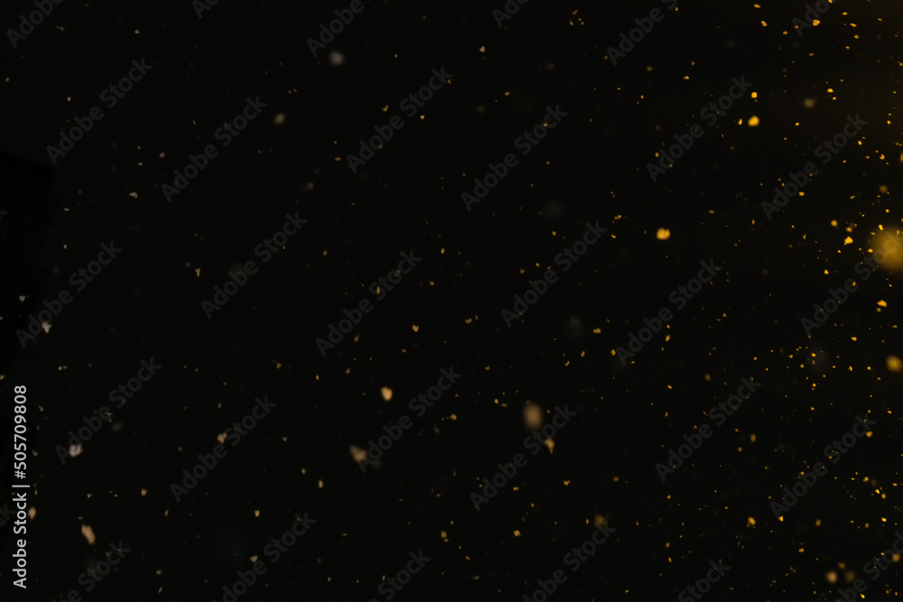 Texture of falling snow at night in the yellow light of lanterns Texture of falling snow at night in the yellow light of lanterns