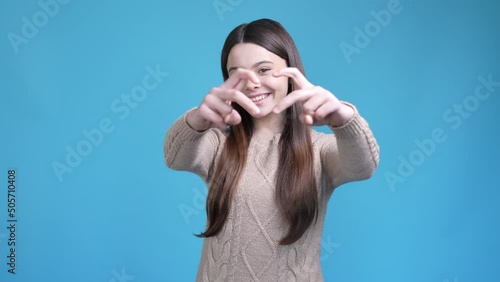 Cute sweet teen lady make love send air kiss isolated blue color background