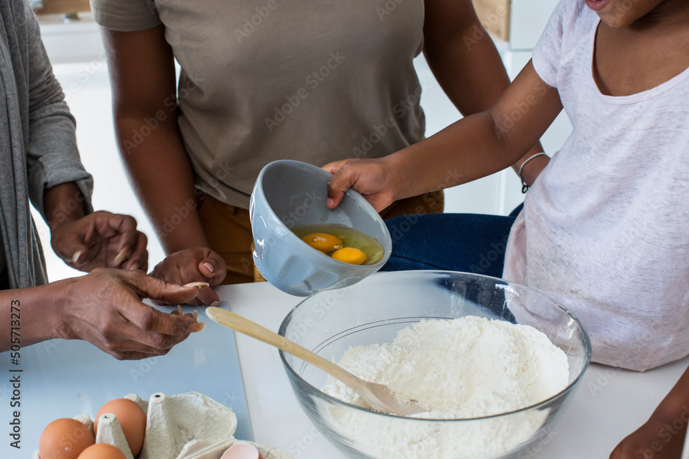 Multi-generation family preparing cookies Multi-generation family preparing cookies