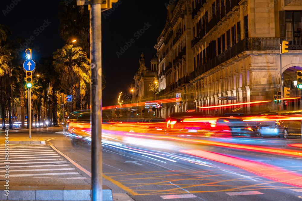 Fotka „Urban night city life in Barcelona, illuminated streets with cars.  Traffic on the avenue with light“ ze služby Stock | Adobe Stock