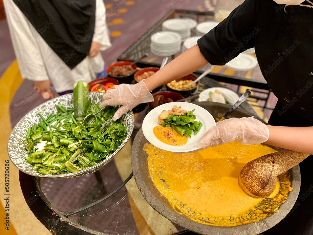 Serving of traditional Javanese food, namely vegetable pecel in the ...