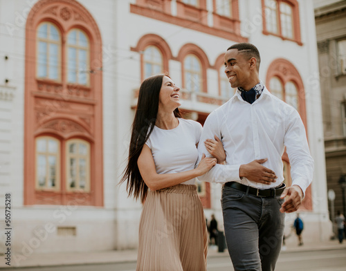 Young multiethnic couple walking on the street