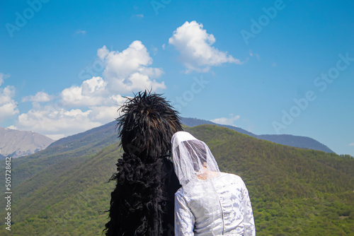 A Georgian man and a woman in a hat. Selective focus. photo