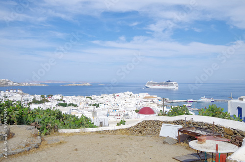 Modern Italian cruiseship cruiseship liner Magnifica anchoring at sea during Summer Aegean Mediterranean Greek Islands Mykonos cruising photo