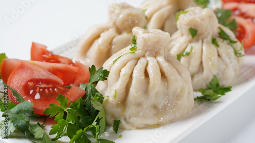 Georgian dumplings Khinkali with meat and red pepper, Traditional National Georgian cuisine.